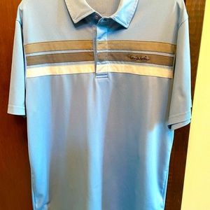 Travis Matthew blue polo with silver/white stripes.
